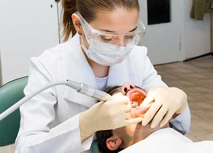 Dr. Matthew Church explains reasons dental oral surgery may be needed for tooth extraction in Indianapolis, IN.